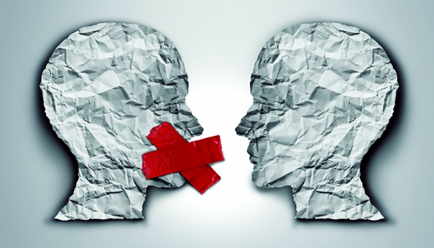 Vector image of two heads with &quot;x&quot; tape over one head's mouth