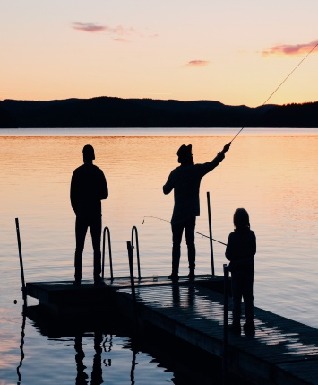 Photo of Three People on a Wooden Dock Fishing by Olof Nyman from Pexels 